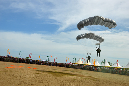 TARAKAN, INDONESIA, 17 DEC 2017 : attraction skydiving in the sky Iraw Tengkayu Festival at Amal Beach Tarakan, Indonesia, in the framework of the 20th anniversary of the cityのeditorial素材