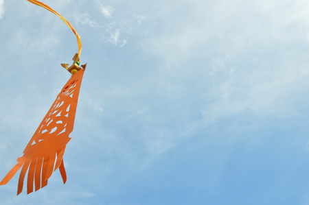 colorful of ornaments flags banners against blue skyの写真素材