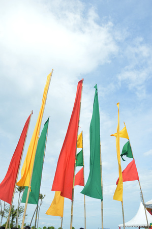 colorful of flags banners against blue sky