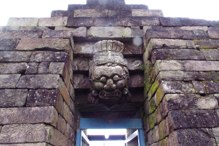 Bas-relief sculptures on wall at encased foot of Sukuh Temple, ancient historical heritage site in central Java  - Indonesiaのeditorial素材
