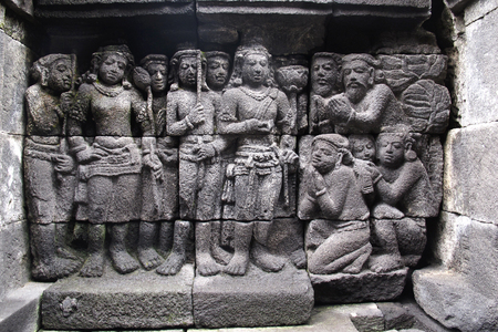 Bas-relief sculptures on wall at encased foot of Borobudur, Indonesiaのeditorial素材