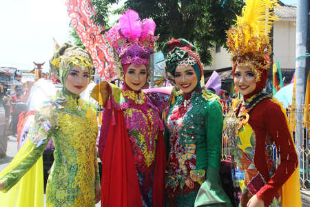TARAKAN - INDONESIA, 25 July 2018 : Portrait of a beautiful Indonesian woman smiling wearing modified custom carnival clothes. APEKSI Cultural Parade Tarakan City in 2018のeditorial素材
