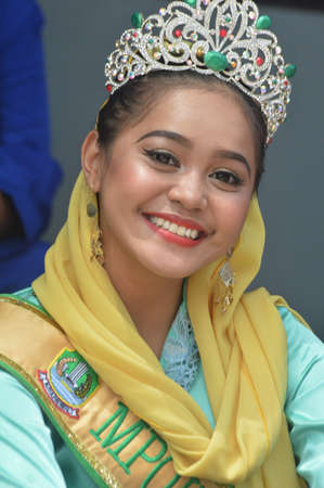 TARAKAN - INDONESIA, 25 July 2018 : Portrait of a beautiful Indonesian woman smiling wearing traditional  clothing from the City of Tangerang or DKI Jakarta. APEKSI Cultural Parade Tarakan City in 2018のeditorial素材
