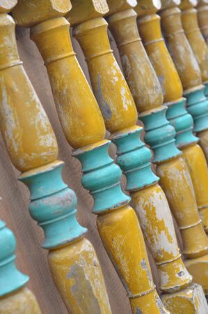 pillars of yellow wooden fences were lined up with selective focus
