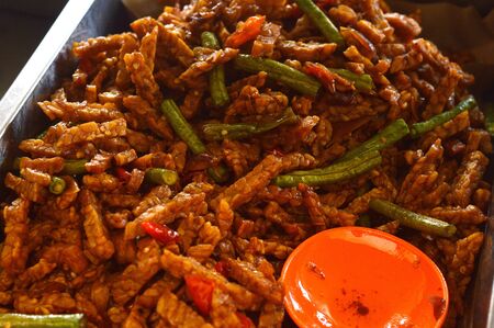 Traditional Indonesian culinery fried tempe with spicy seasoning mixed with string beans