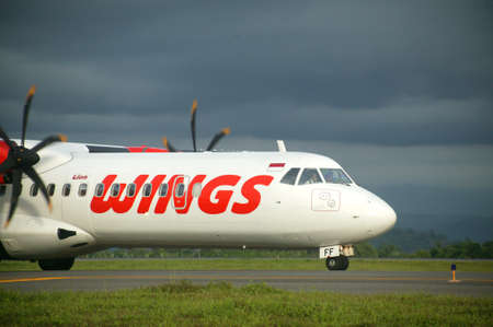 MAKASSAR-  INDONESIA - 4th November 2010 ; wings air plane on the runway Hasanuddin Airport Makassar, IndonesiaMakassar, Indonesiaのeditorial素材