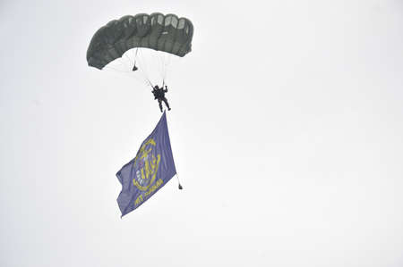 TARAKAN - INDONESIA, 10 MAY 2017  : skydiving attractions by members of the Indonesian armed forces at the Latsitarda closing ceremony at the Datu Adil Stadiumのeditorial素材