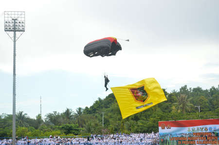 TARAKAN - INDONESIA, 10 MAY 2017  : skydiving attractions by members of the Indonesian armed forces at the Latsitarda closing ceremony at the Datu Adil Stadiumのeditorial素材