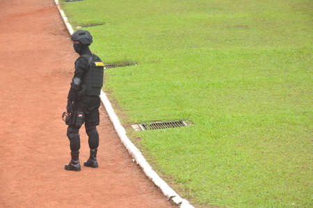 TARAKAN - INDONESIA, 10 MAY 2017 : Indonessian Police wearing black anti-riot safety vests
