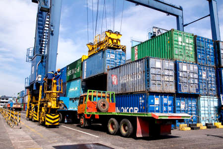 MAKASSAR-  INDONESIA - 18th July 2011 : container loading and unloading activities in the port of...