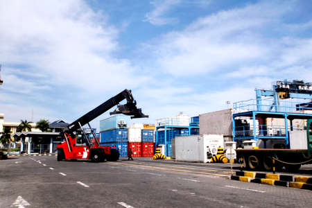 MAKASSAR-  INDONESIA - 18th July 2011 : container loading and unloading activities in the port of Makassarのeditorial素材