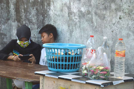 TARAKAN - INDONESIA 22 APRIL 2020 : flower petals in crackle bags which are sold to grave pilgrimsのeditorial素材