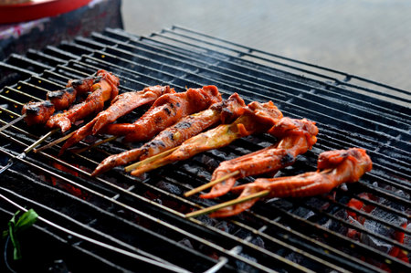 grilled chicken wings in the process of burningの写真素材