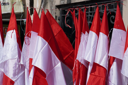 Indonesian red and white flags of various sizes hanging at the sales place shortly before the day of the proclamation of Indonesian independenceの写真素材