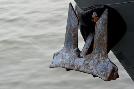 rusting anchor on an iron ship
