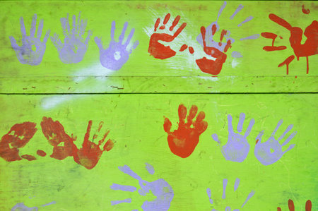 hand painted pattern image on green wooden wallの写真素材