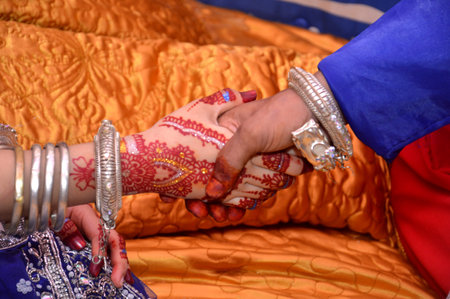 Bugis bride and groom shaking handsの写真素材