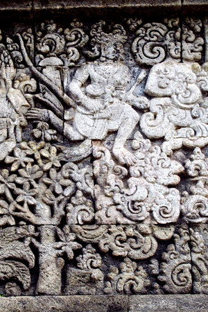 relief or carving on the stone wall at Penataran templeの写真素材