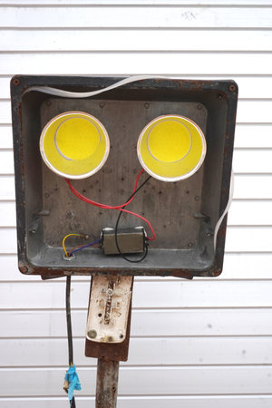 Inspect this outdoor floodlight with exposed wiring. Perfect for safety inspections, electrical...