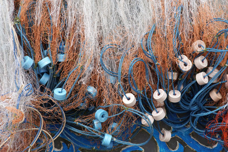 Discover the rich texture of fishing nets, a detailed close-up showcasing maritime equipment with...