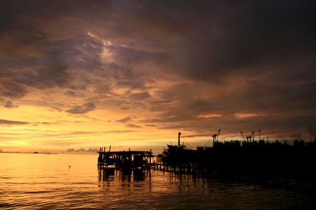 Experience the tranquility of a dramatic sunset over the ocean. Perfect for travel, relaxation, or...