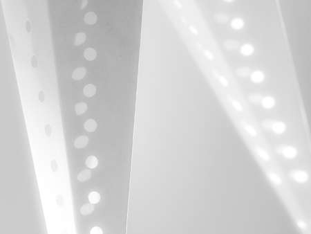 A modern image with white circles and diagonal lines in soft focus.Backgroundの写真素材