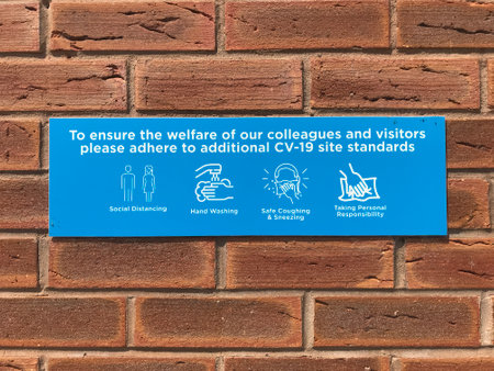 Dangerous Covid-19 Coronavirus (2019-nCoV) sign on a brick wallの写真素材