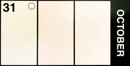 A calendar date of 31st October signifying Halloween. Number 31 and October in bold white text on...