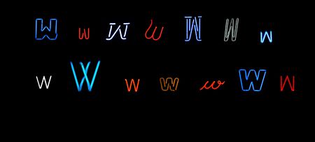 collection of a number of different neon letter w isolated on black - part of a series of neon lettersの写真素材