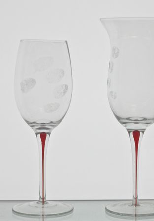 wine glasses isolated on whitewith finger printsの写真素材