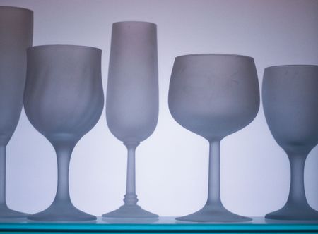collection of frosted wine glasses isolated on whiteの写真素材