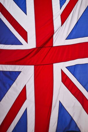British Union Jack flag rippled in the windの写真素材