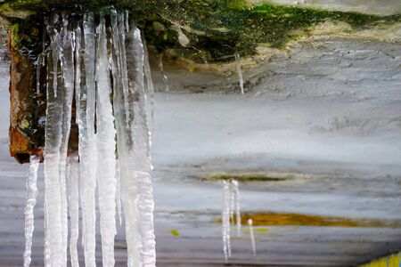 Ice stalactites under the bridge