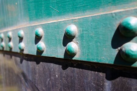 Rivets on a steel wallの写真素材