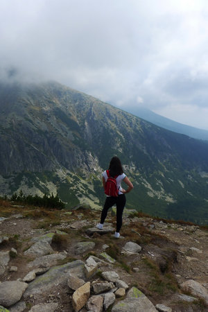 A woman admiring the beauty of the mountainsのeditorial素材