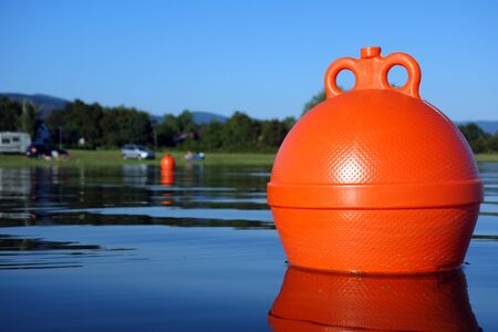 Floating buoy on the lakeの写真素材