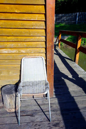 Wooden fishing hut on the pond
