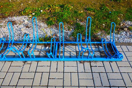 Metal bicycle stand in the cityの写真素材