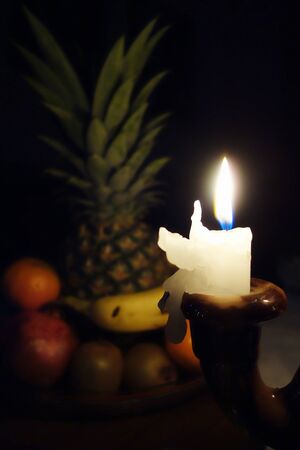 Christmas candle burning on Christmas Eveの写真素材