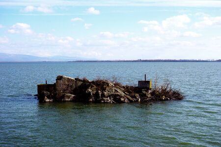 Deserted rocky island on the lakeの写真素材