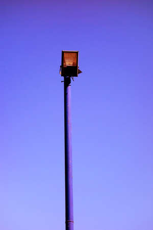 LED street lamp on a white day under a blue skyの写真素材
