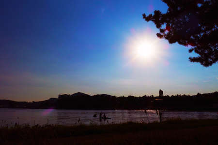 Sunshine over the summer beach at sunset
