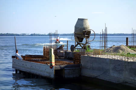 Construction of a lake pier under construction