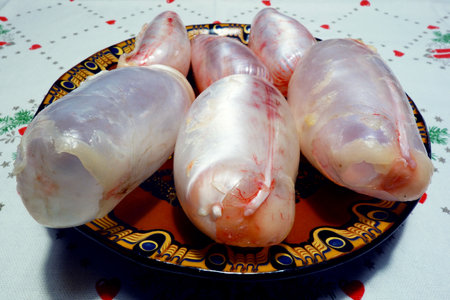 Carp bladder on a plate on a Christmas tablecloth