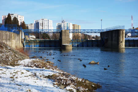 City dam with ducks at the housing estate with blocks of flatsの写真素材