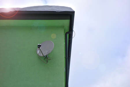 Satellite on the wall of the buildingの写真素材