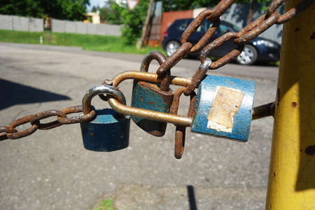 Locked padlock on the chainの写真素材