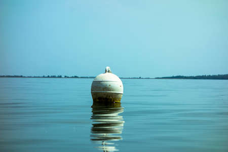 A floating ship buoy near the port, serves as a floating anchor for ships