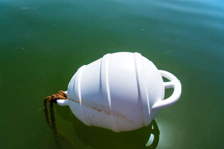 A floating ship buoy near the port, serves as a floating anchor for shipsの写真素材