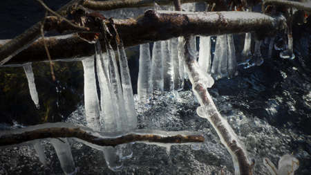 Beautiful icicles on a frozen mountain stream